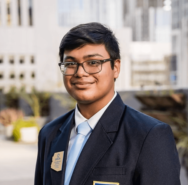 Shubham Gupta in DECA blazer with Arizona officer badge